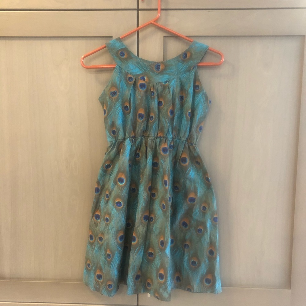 Handmade peacock feather dress by UK designer